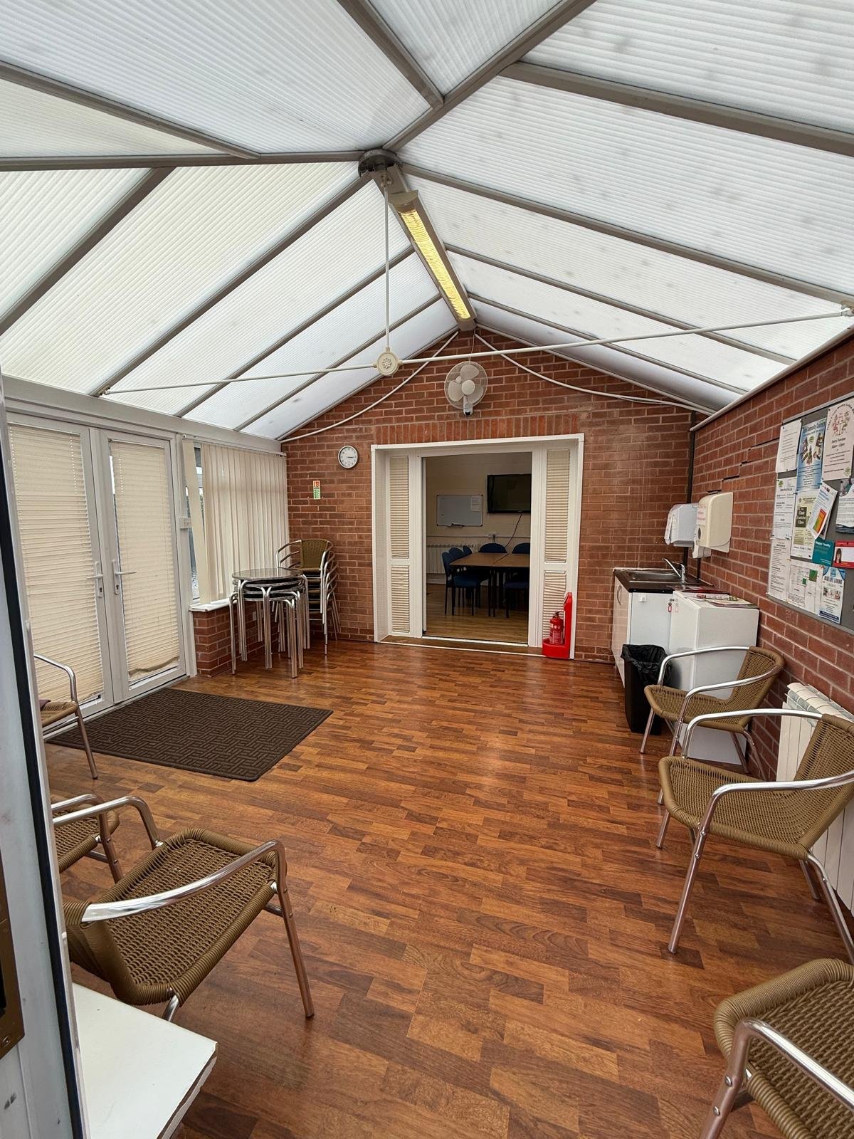 Bright conservatory area at Caring Places day centre